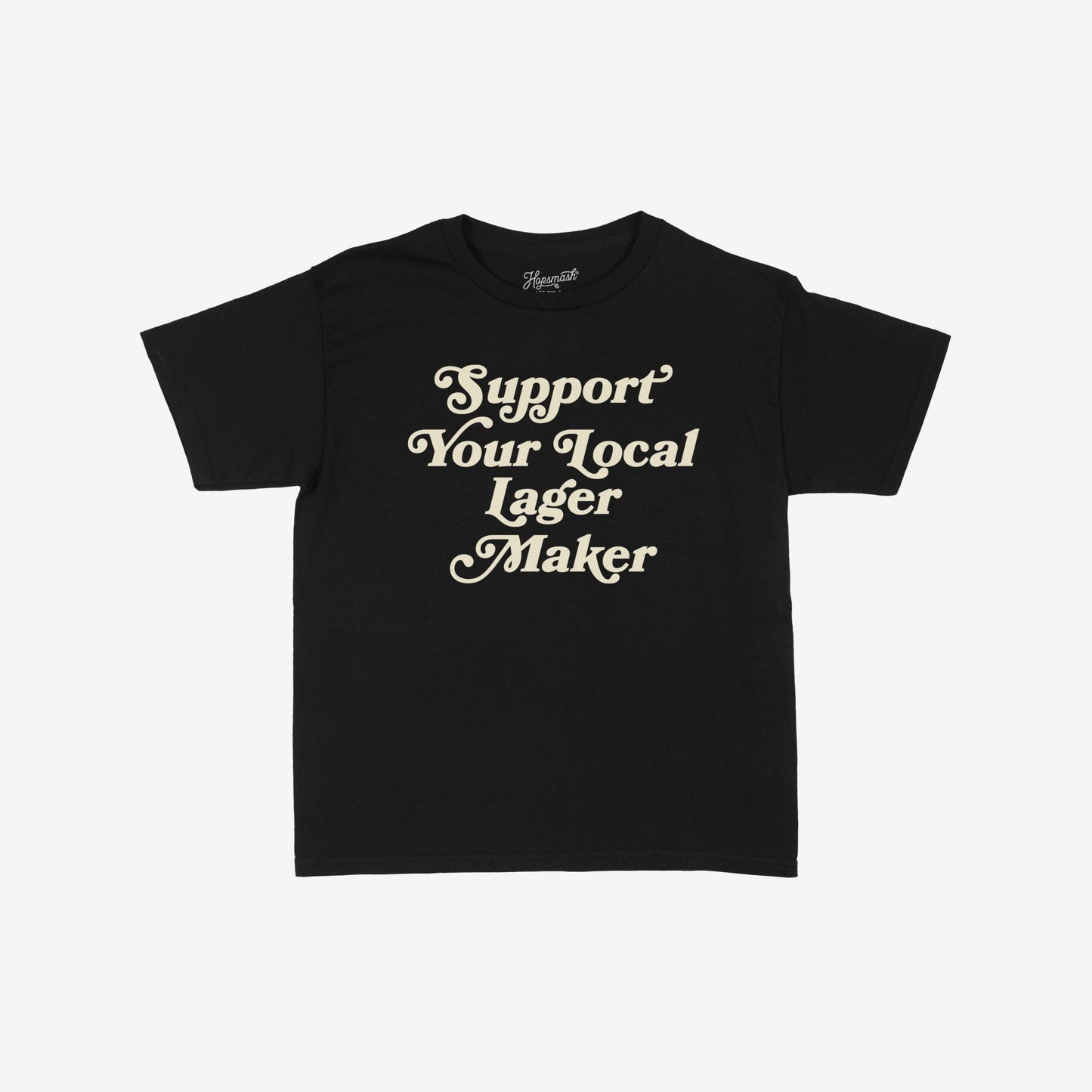 Support Your Local Lager Maker Women's Baby Tee, featuring vintage off-white serif text on black, embodies rebellious, retro energy. Perfect for brewery adventures and showcasing support for small-batch brewers.