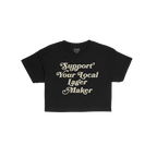 Support Your Local Lager Maker Women's Baby Tee, featuring vintage off-white serif text on black, embodies rebellious, retro