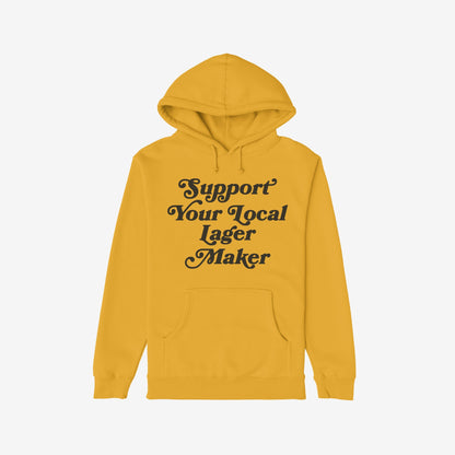 Mustard-yellow Support Your Local Lager Maker hoodie featuring a hood, drawcords, and kangaroo pocket, embodying a bold, retro style. Ideal for craft beer enthusiasts promoting local breweries.