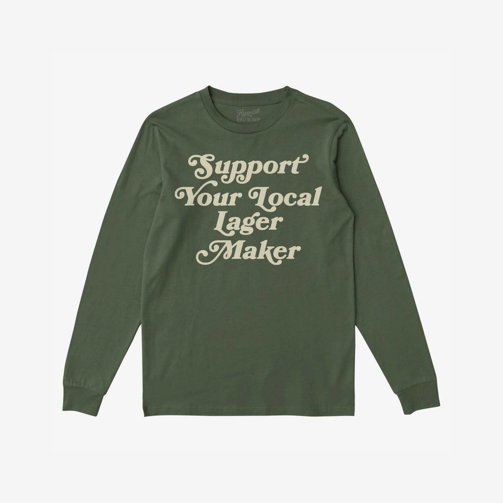 Support Your Local Lager Maker T-shirt with vintage cream text promotes indie breweries. Perfect for craft beer enthusiasts and those who champion local businesses, aligning with a message of community support and equality.
