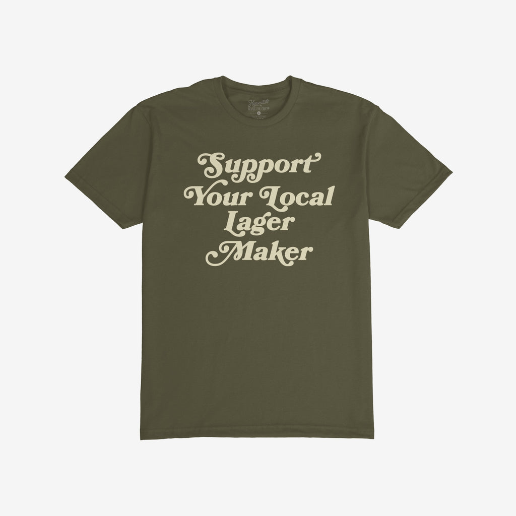 Support Your Local Lager Maker T-shirt featuring retro cream script, embodying neighborhood brewery pride and small-batch spirit. Ideal for beer lovers who value local craftsmanship and community over corporate brands.