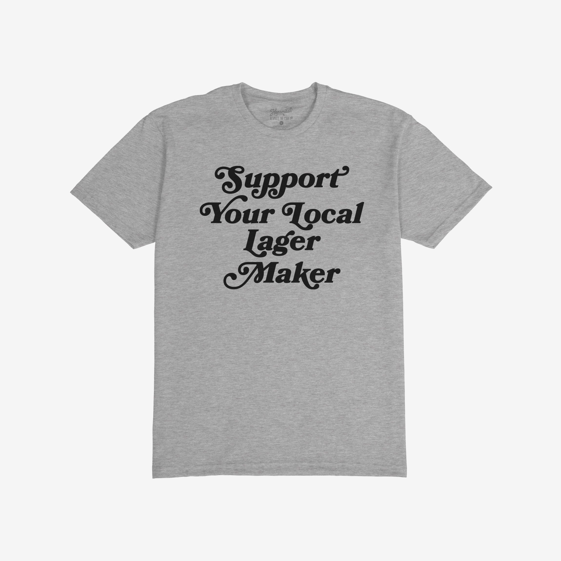 Light-gray T-shirt reading “Support Your Local Lager Maker” in black, stylized lettering, embodying a commitment to local brewers. Ideal for those passionate about craft beer and community support.