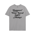 Light-gray T-shirt reading “Support Your Local Lager Maker” in black, stylized lettering, embodying a commitment to local