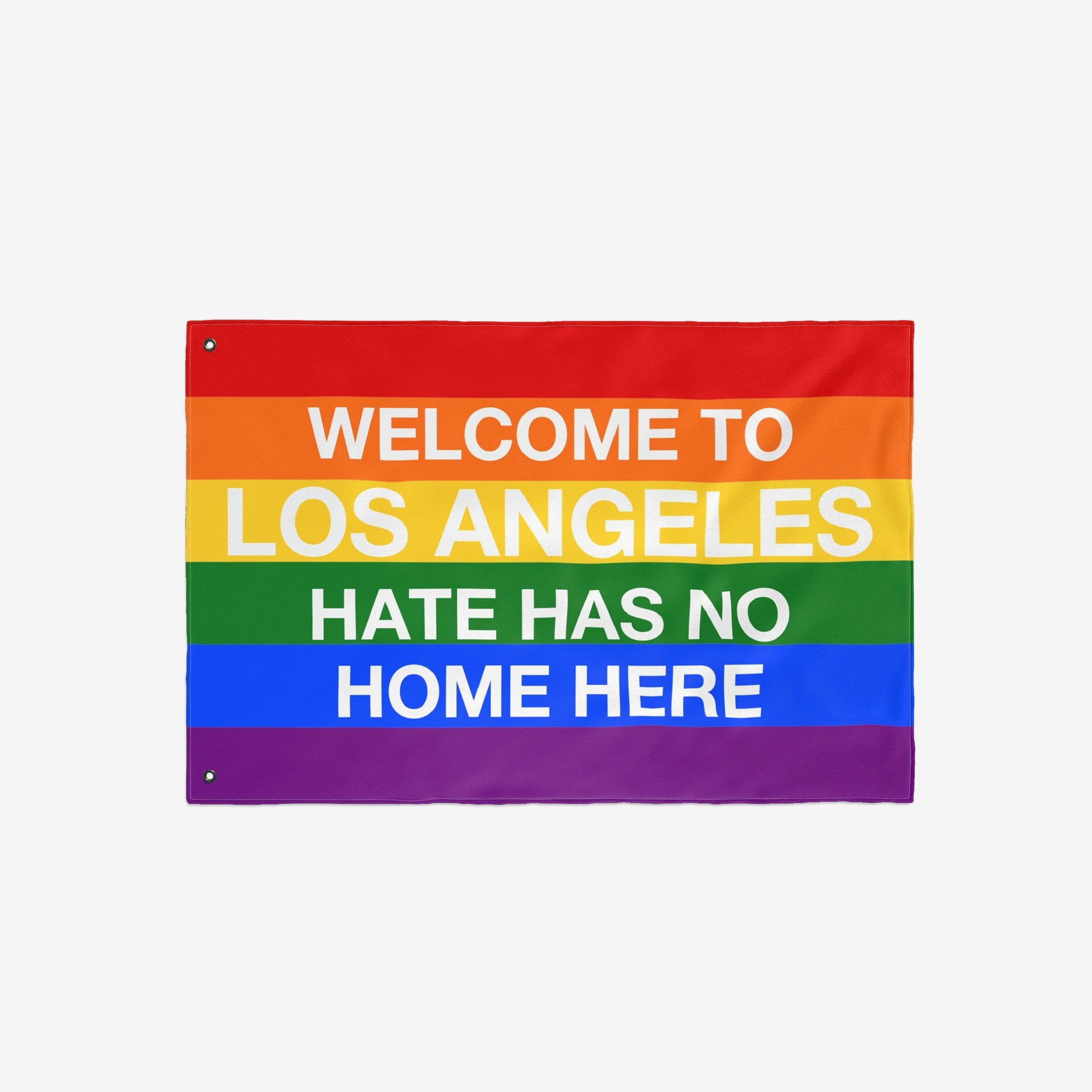 Custom Hate Has No Home Here Pride Flag featuring vibrant rainbow stripes and bold message WELCOME TO LOS ANGELES HATE HAS NO HOME HERE, symbolizing love, unity, and belonging; customizable with your city name.
