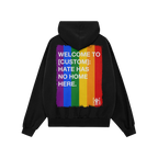 Custom Hate Has No Home Here Pride Hoodie features a black back view with a brushed rainbow flag and customizable message, em