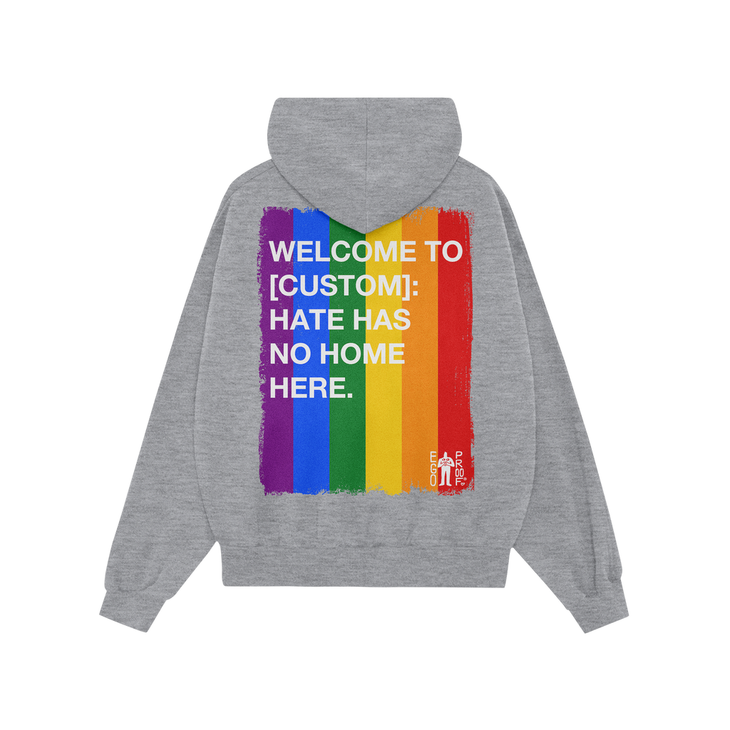 The Custom Hate Has No Home Here Pride Hoodie displays a distressed rainbow graphic with a bold, inclusive message, merging c