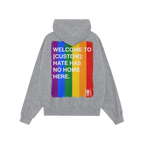 The Custom Hate Has No Home Here Pride Hoodie displays a distressed rainbow graphic with a bold, inclusive message, merging c