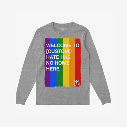 Custom Hate Has No Home Here Pride Long Sleeve T-shirt features a bold vertical rainbow stripe with an inclusive message, ideal for showcasing support and equality at Pride events or daily wear.