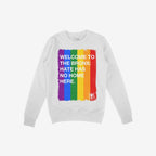 Custom Hate Has No Home Here Pride Sweatshirt features bold text over a rainbow stripe graphic. This midweight crewneck champions inclusivity and LGBTQ+ pride with its empowering message.