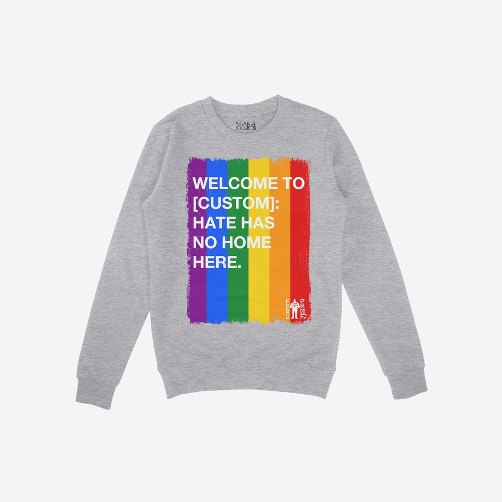 Custom Hate Has No Home Here Pride Sweatshirt with painted-brush rainbow stripe and empowering message, featuring EGO PROOF logo, embodies inclusivity and LGBTQ+ pride, blending style with purpose.