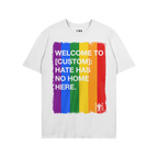 Custom Hate Has No Home Here Pride T-shirt featuring a rainbow brush-stroke panel with customizable location text and bold an