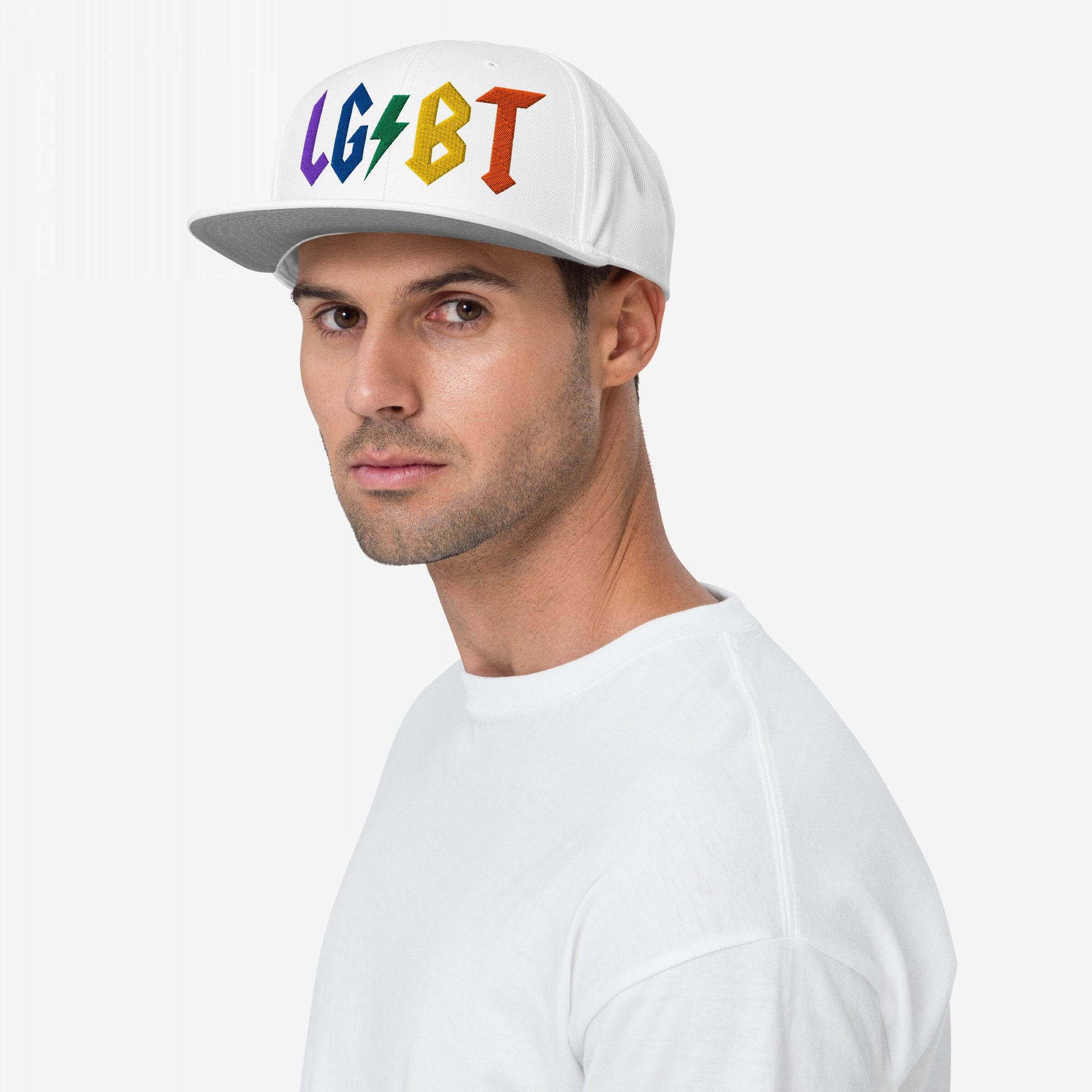 Man wearing white snapback hat with rainbow embroidered LGBT lightning bolt on front, LGBTQ Rocks Hat.