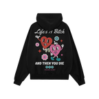 Life's A Bitch Shirt featuring retro-cartoon design with cheerful, dancing hearts and bold slogans, capturing a candid, unapo
