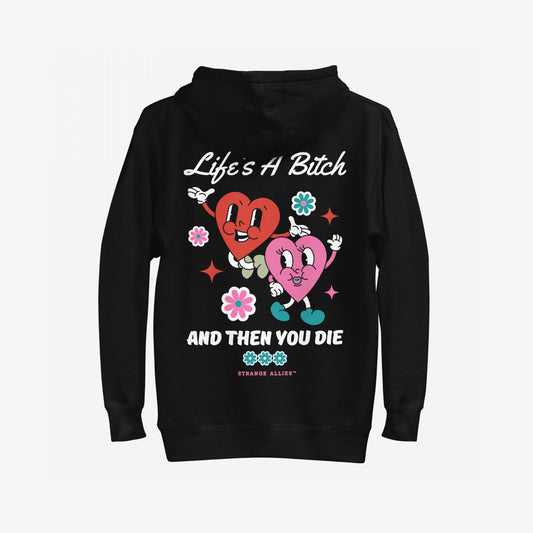 Life's A Bitch Hoodie & Sweatshirt features retro-cartoon anthropomorphic hearts with playful motifs and bold text, embracing a candid, rebellious spirit. Ideal for those challenging life's illusions with comfort and style.