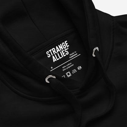 Close-up of the Life's A Bitch Hoodie & Sweatshirt, showcasing the neck label with brand STRANGE ALLIES, size S, and care icons. Highlighting soft fleece for unfiltered realism.