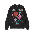 Black crewneck sweatshirt featuring the Life's A Bitch design with two smiling hearts, flowers, and sparkles, encapsulating a