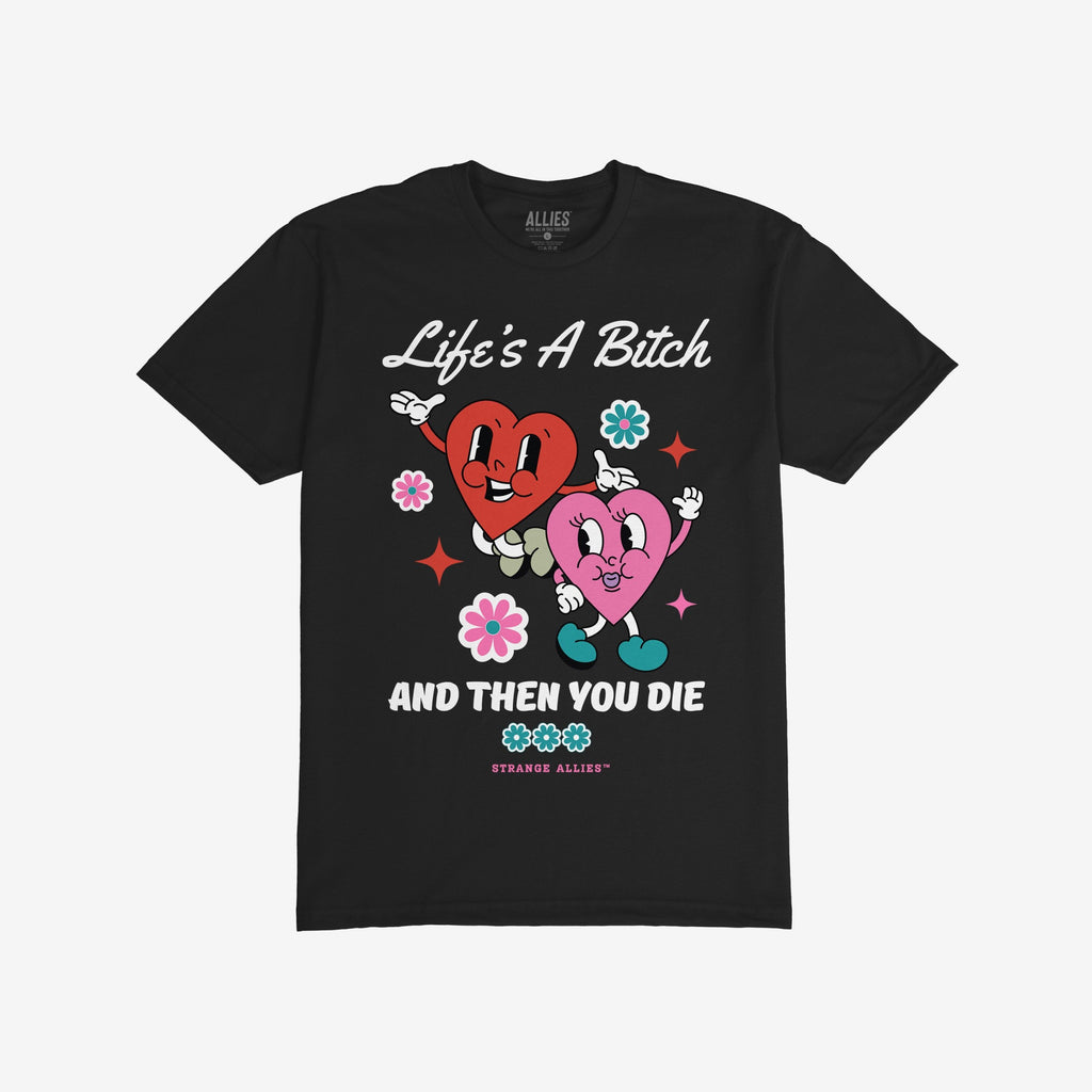 Life's A Bitch Shirt featuring dancing cartoon hearts and bold text expressing life's harsh truth. Perfect for those embracing reality with humor. Brand: Strange Allies.