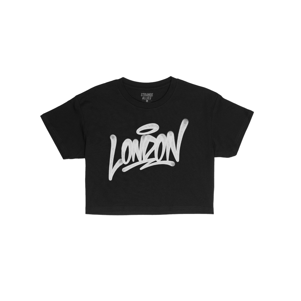 London Handstyle Women's Baby Tee in black, featuring bold white graffiti-style London script across the chest. Brand name St