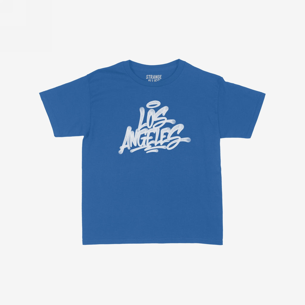 Royal-blue crew-neck T-shirt, Los Angeles in white graffiti script on front. Inside neck label reads “STRANGE ALLIES.” This Los Angeles Handstyle Women's Baby Tee showcases bold, retro Y2K style.