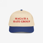 MAGA Is A Hate Group Hat features a beige crown with a blue brim, embroidered boldly in red. Perfect for progressives and equality supporters, this hat embodies a strong, anti-fascist message.