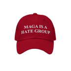 Red baseball-style cap featuring the bold white text MAGA IS A HATE GROUP embroidered on the front, reflecting progressive an
