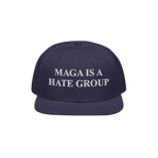 Navy-blue snapback cap with white embroidery reading MAGA Is A Hate Group, symbolizing progressive, anti-fascist, and equalit