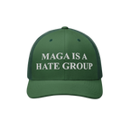 Forest-green trucker-style cap with MAGA IS A HATE GROUP embroidered in white on the front, featuring a mesh back and curved 