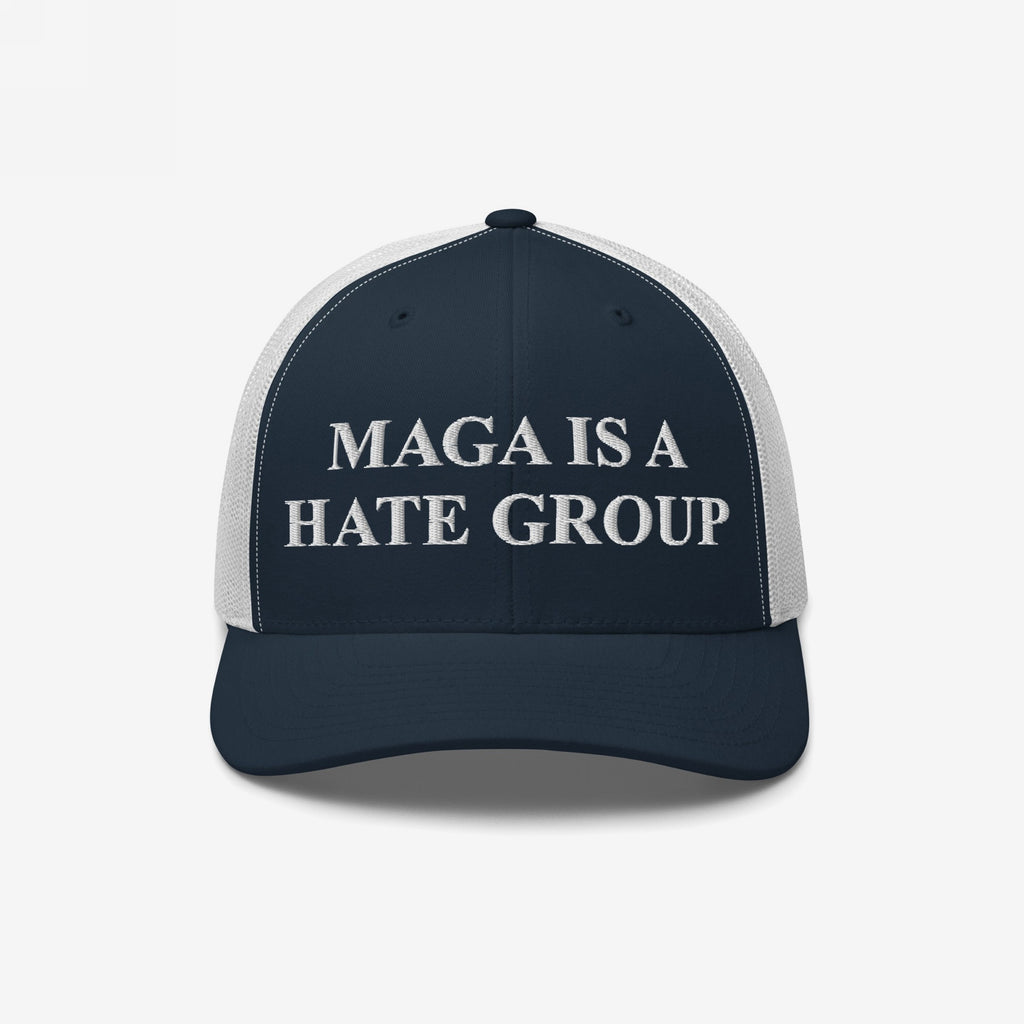 Navy-blue mesh trucker cap with MAGA IS A HATE GROUP embroidered on the front, reflecting anti-fascist and equality themes.