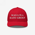 Red baseball-style cap featuring white embroidered text: MAGA Is A Hate Group. Ideal for progressives and equality supporters, available in various styles and colors, representing a stand against hate politics.