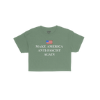 Make America Anti-Fascist Again Women's Baby Tee features a green T-shirt with a stylized American flag and bold slogan, embo