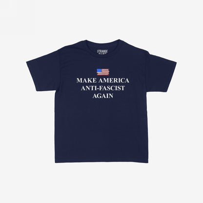 Navy-blue crew-neck T-shirt titled Make America Anti-Fascist Again Women's Baby Tee, featuring a small painted American flag and bold white slogan, embodying a statement of resistance and equality.