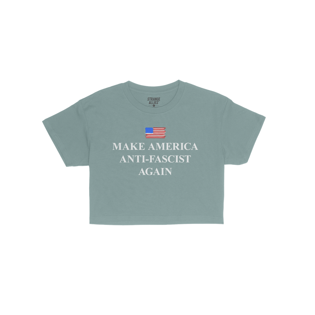 Navy-blue crew-neck T-shirt titled Make America Anti-Fascist Again Women's Baby Tee, featuring a small painted American flag 