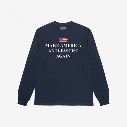 Navy-blue long-sleeve tee with a distressed U.S. flag graphic and MAKE AMERICA ANTI-FASCIST AGAIN in bold white lettering, embodying a strong anti-fascist message. Neck label reads STRANGE ALLIES.