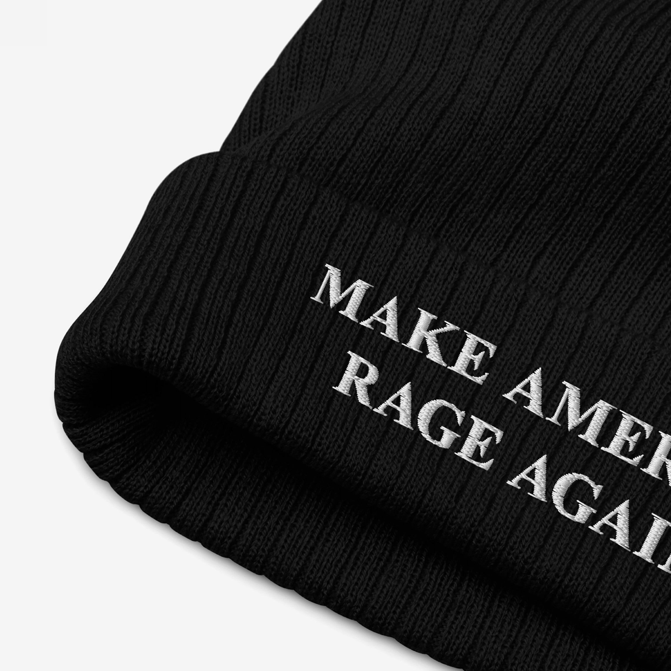Black knit beanie featuring the bold, white embroidered text MAKE AMERICA RAGE AGAIN, representing an anti-fascist statement. Ideal for those committed to activism and making their values visible.