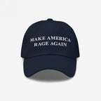 Dark-navy Make America Rage Again Hat with white embroidered text, embodying anti-fascist protest spirit. Ideal for marches and daily wear, showcasing commitment to equality and resistance.