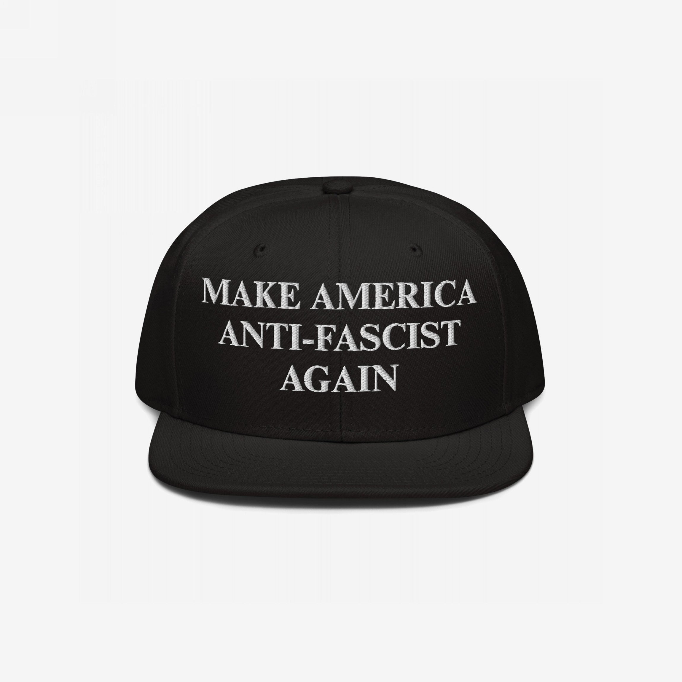 Black flat-brim snapback hat with MAKE AMERICA ANTI-FASCIST AGAIN in white embroidery, promoting democratic values and anti-fascism. A bold statement against authoritarianism, aligning with equality and inclusivity.