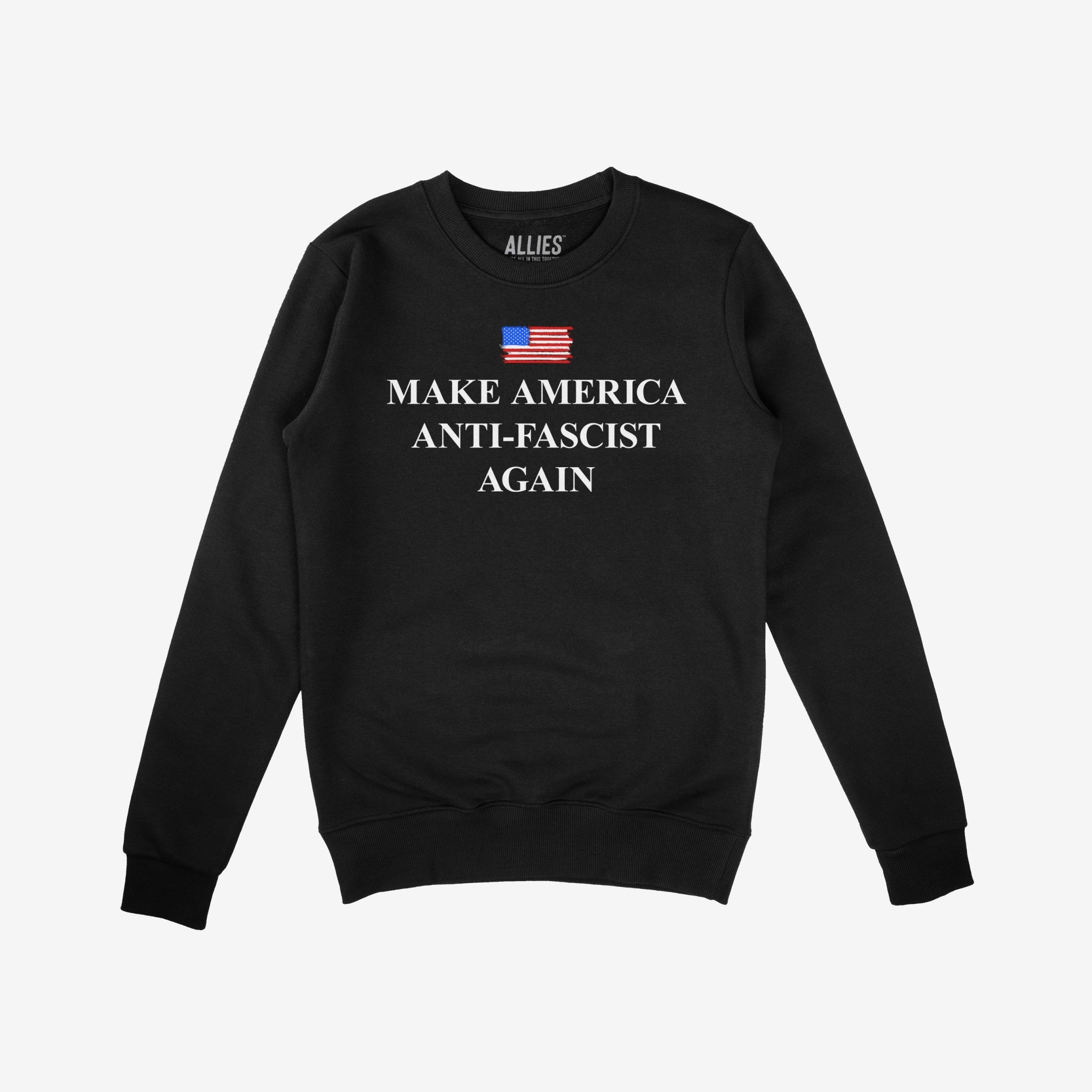 Black crew-neck sweatshirt featuring Make America Anti-Fascist Again beneath a stylized American flag, designed to symbolize democracy and civil rights advocacy. Branded “ALLIES” at the collar.