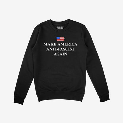 Black crew-neck sweatshirt featuring Make America Anti-Fascist Again beneath a stylized American flag, designed to symbolize democracy and civil rights advocacy. Branded “ALLIES” at the collar.