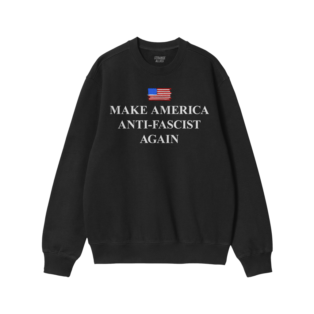 Black crew-neck sweatshirt featuring Make America Anti-Fascist Again beneath a stylized American flag, designed to symbolize 