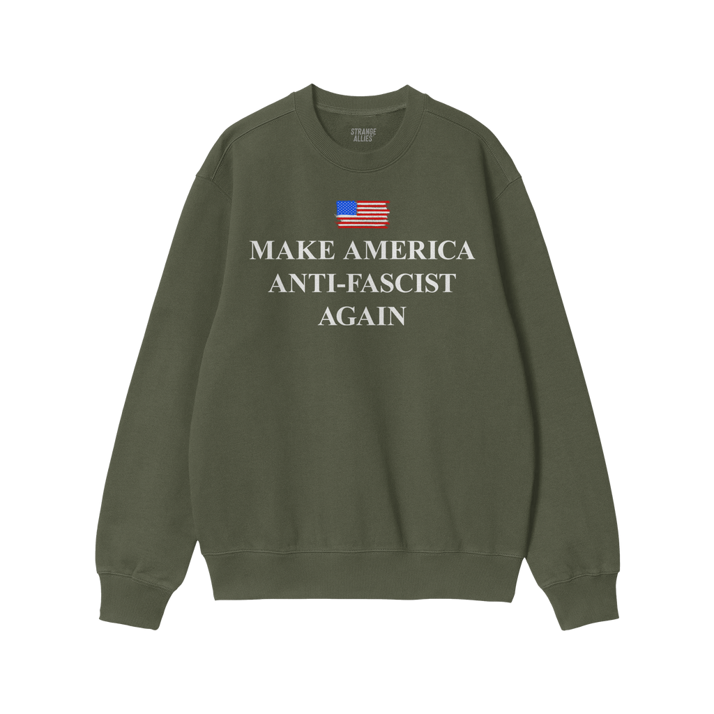 Dark-green crewneck sweatshirt titled Make America Anti-Fascist Again, featuring a small American flag and bold white slogan.