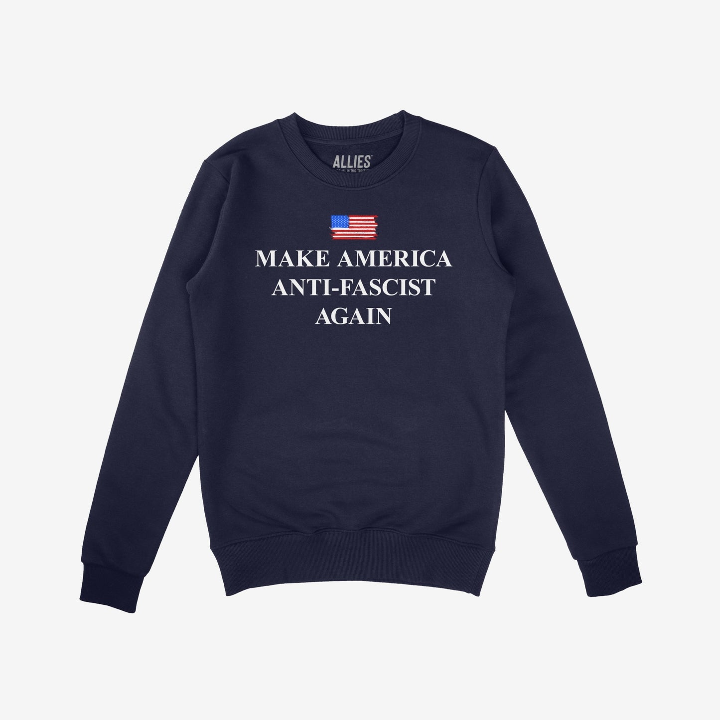 Navy-blue crewneck sweatshirt with Make America Anti-Fascist Again under a small American flag, embodying a bold stance against authoritarianism for those championing democracy and equality.