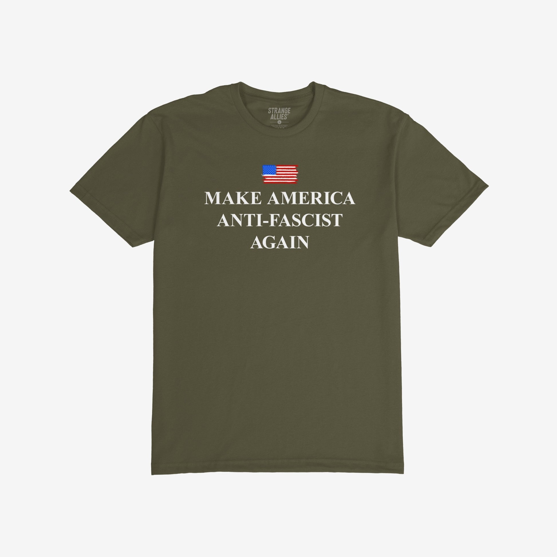 Make America Anti-Fascist Again T-shirt with a small U.S. flag and bold serif slogan, reflecting a stance against authoritarianism, showcasing the message above “STRANGE ALLIES” label inside the collar.