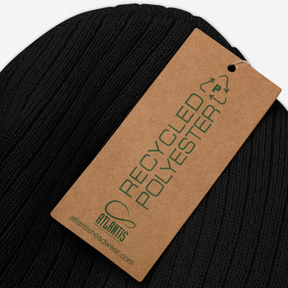Close-up of the Make Art Every Day Hat, a black rib-knit beanie with RECYCLED POLYESTER tag, emphasizing creativity and sustainable fashion, perfect for artists committed to innovation.