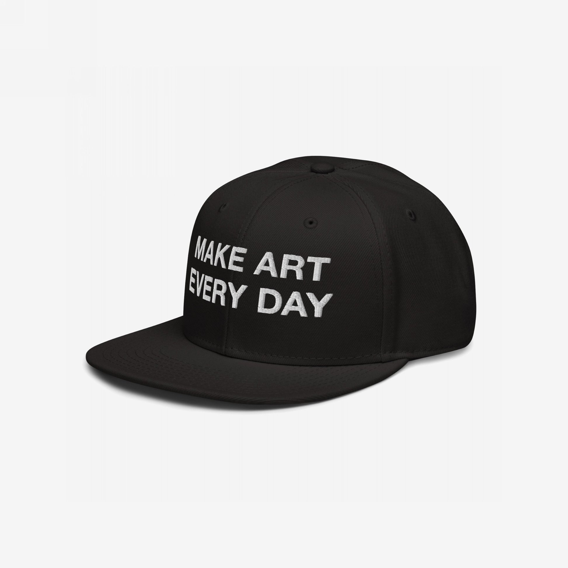 Make Art Every Day Hat: A black snapback cap with 'MAKE ART EVERY DAY' in bold white embroidery, designed for comfort and creativity, featuring EGOPROOF stitching on the back for committed creators.
