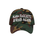 Camo-patterned Make Fascists Afraid Again hat with white, hand-drawn embroidery. Designed for bold resistance and activism, s