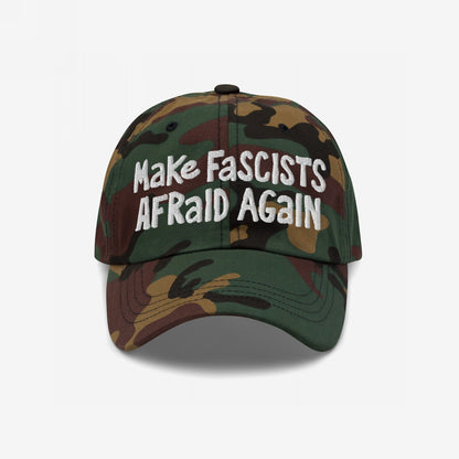 Camouflage-print baseball cap with Make Fascists Afraid Again in bold, white embroidery, capturing an unapologetic stance against fascism, reflecting resistance and activism through its hand-drawn style and easy fit.