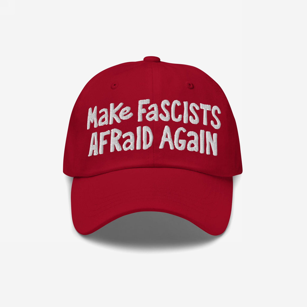Make Fascists Afraid Again Hat featuring bold white embroidery on a red baseball cap, embodying anti-fascist sentiment with a casual, defiant style.