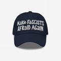 Make Fascists Afraid Again hat features bold white embroidery on a dark-navy cap, embodying defiance with raw, hand-drawn style, perfect for protests or daily wear with a statement.