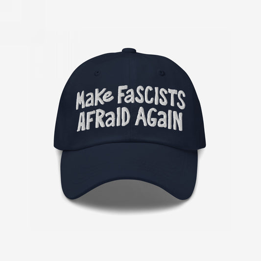 Make Fascists Afraid Again Hat with bold, white embroidered text on a dark navy-blue cap, embodying unapologetic resistance and activism. Available in multiple styles, supporting Amnesty International.