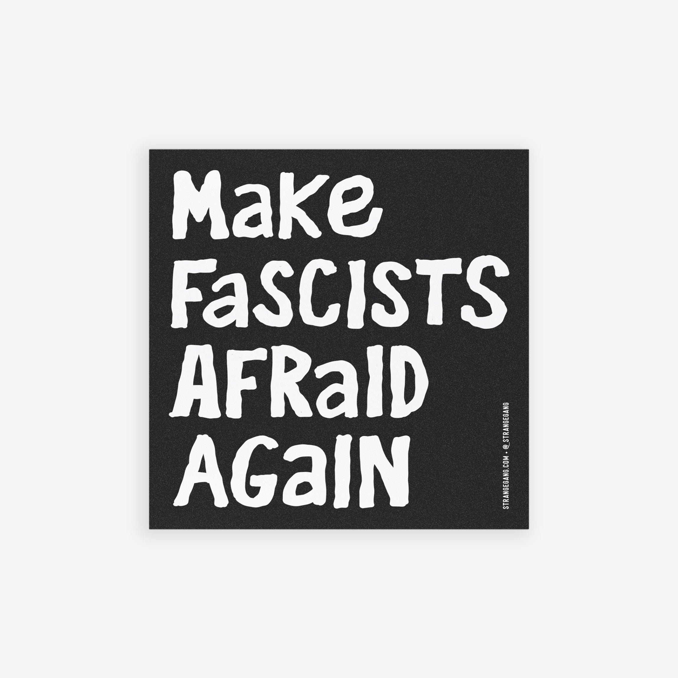 Make Fascists Afraid Again Sticker & Magnet on a black panel with bold white text, set against a blurred park background. Features a starburst noting 'Choose magnet or sticker' with artist credit visible.